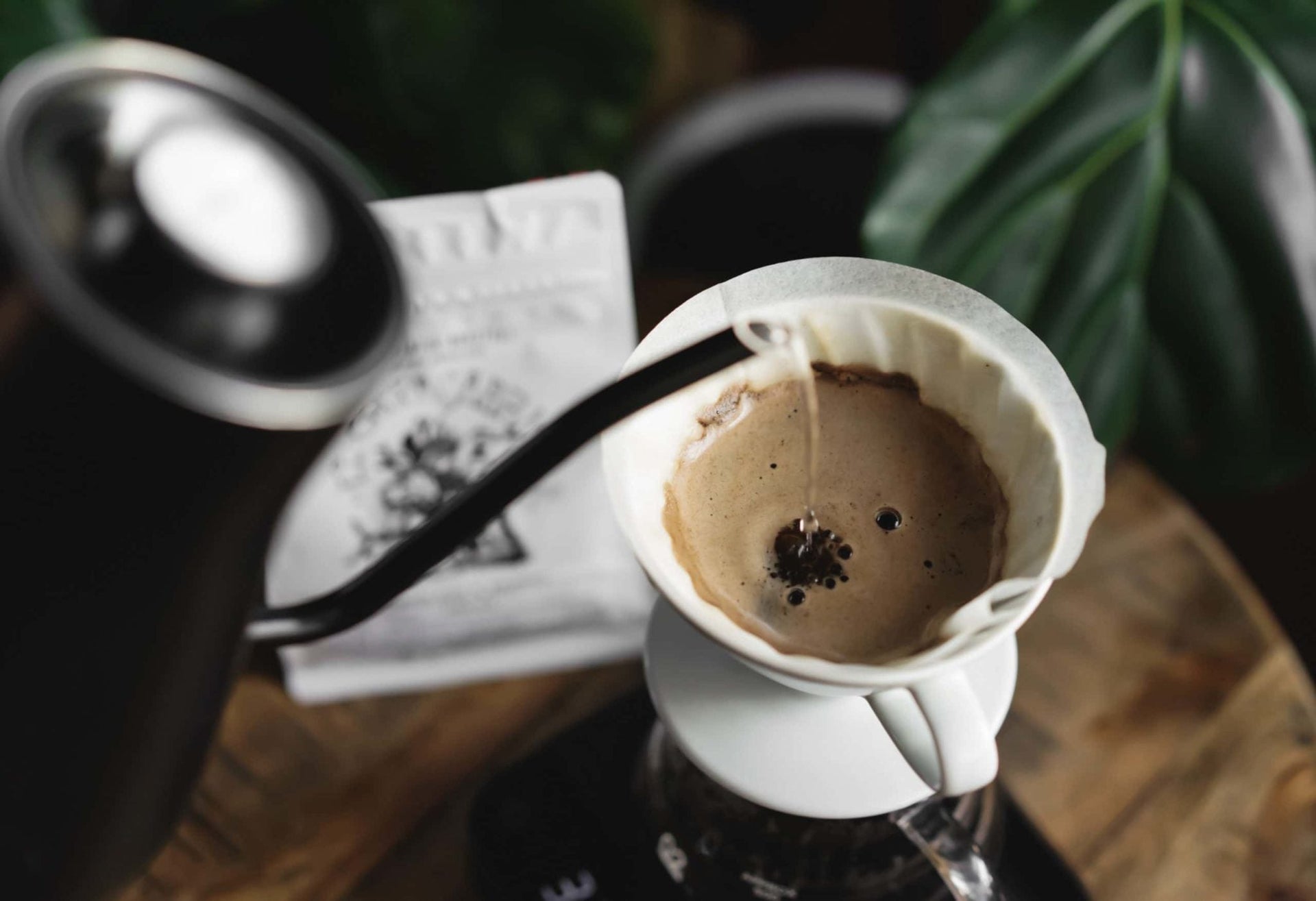 Demonstrating V60 pour-over in a sophisticated cafe